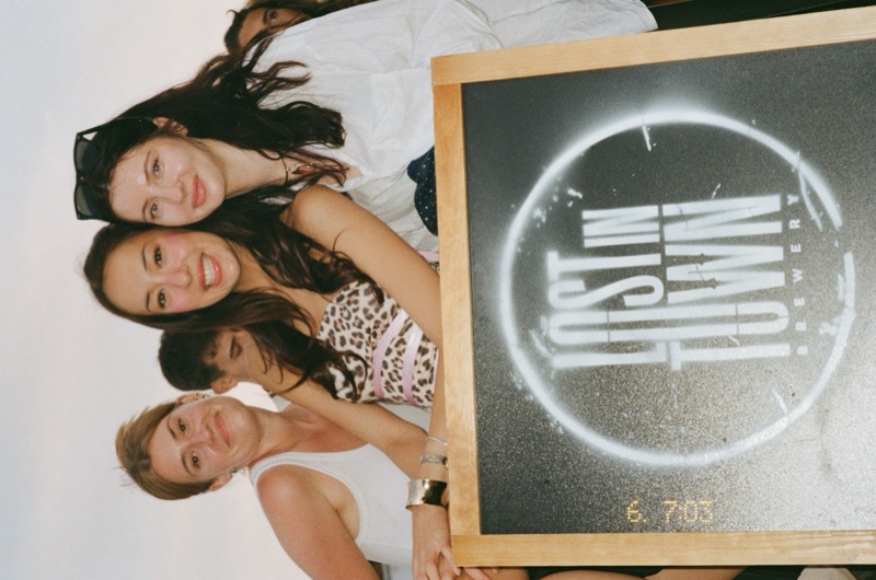 Visitors with Lost in Town sign at Taste of London